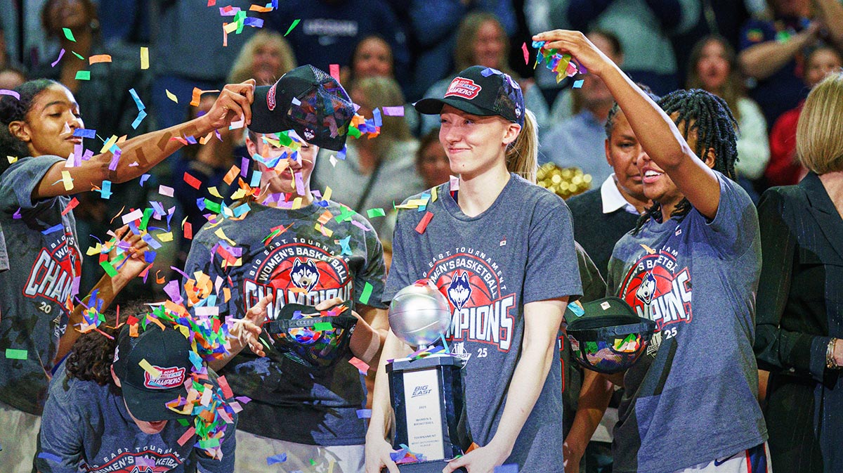 UConn Huskies guard Paige Bueckers (5) holds her “Most Outstanding Player” trophy as the team celebrates their Big East Championship win over the Creighton Bluejays at Mohegan Sun Arena in women's NCAA Tournament.