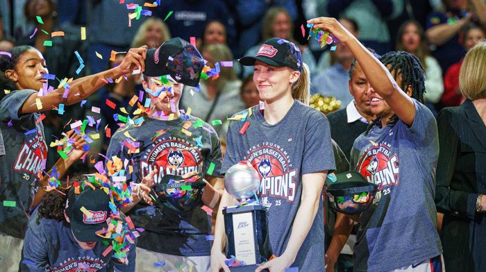 UConn Huskies guard Paige Bueckers (5) holds her “Most Outstanding Player” trophy as the team celebrates their Big East Championship win over the Creighton Bluejays at Mohegan Sun Arena in women's NCAA Tournament.