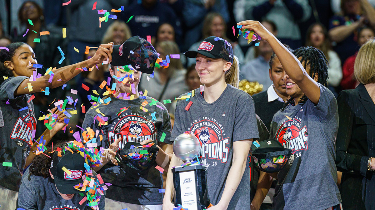 UConn Huskies guard Paige Bueckers (5) holds her “Most Outstanding Player” trophy as the team celebrates their Big East Championship win over the Creighton Bluejays.