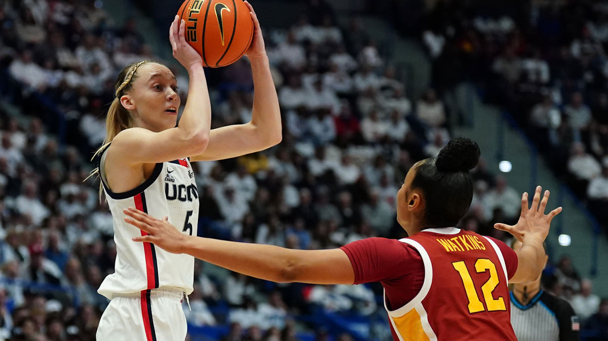 UConn Huskies guard Paige Bueckers (5) looks to pass the ball against USC Trojans guard JuJu Watkins (12) in the first half at XL Center.