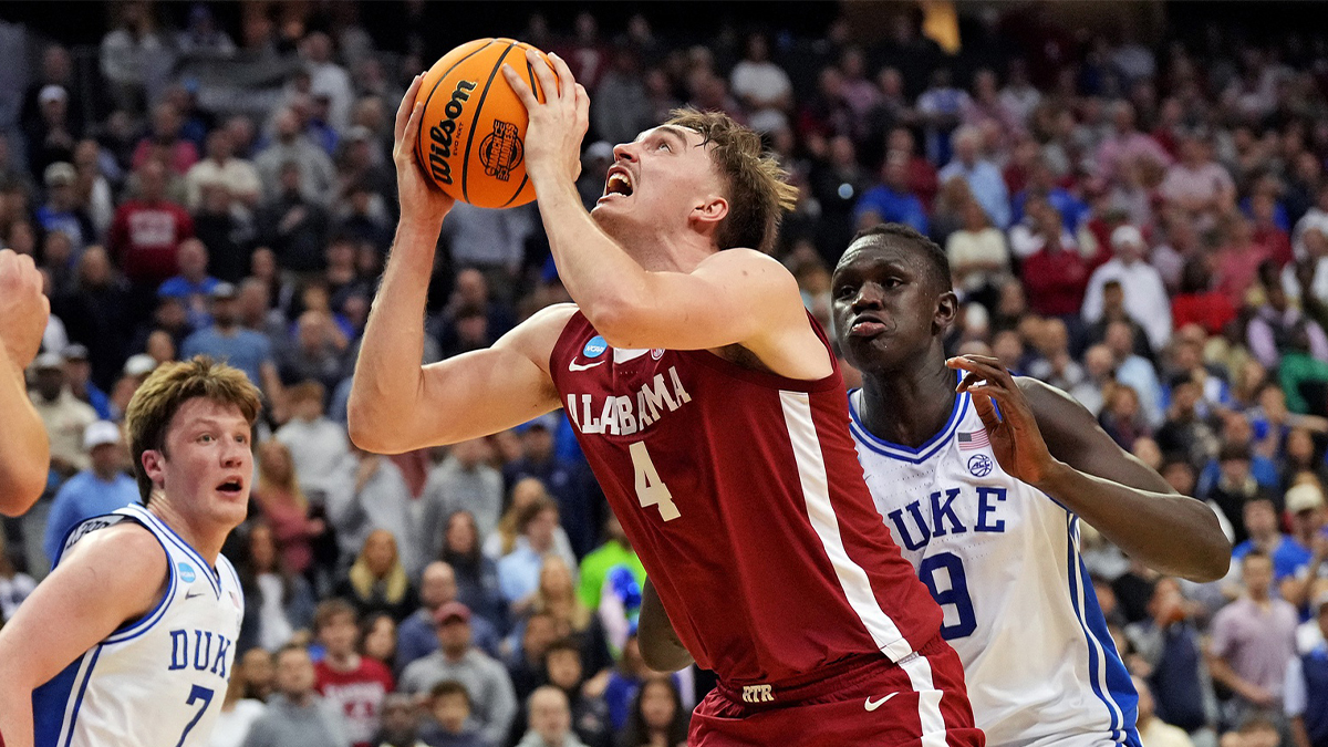 Alabama Crimson Tide forward Grant Nelson (4) blocks the shot of Duke Blue Devils forward Cooper Flagg (2) during the first half in the East Regional final of the 2025 NCAA tournament at Prudential Center.