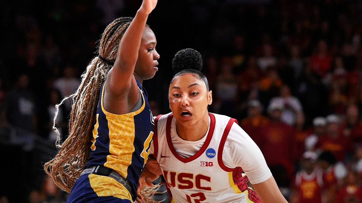 USC Trojans guard JuJu Watkins (12) drives to the basket as UNC Greensboro Spartans guard Nia Howard (44) defends during the first quarter of an NCAA Tournament game at Galen Center.