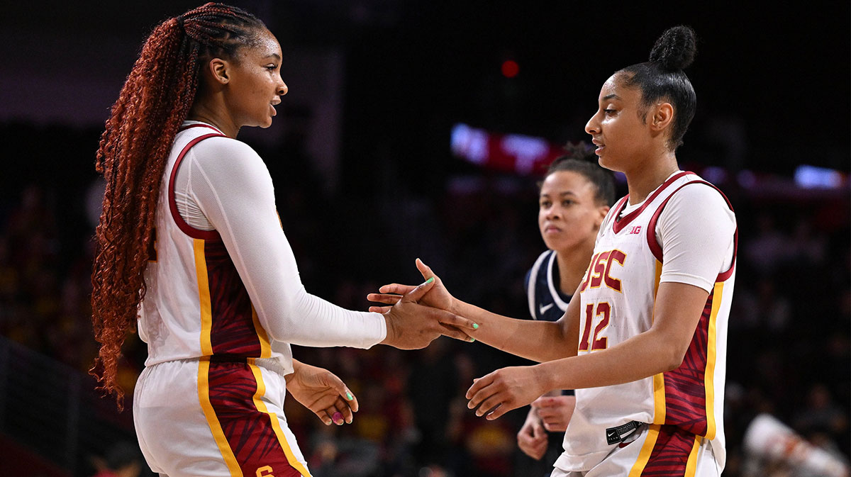 USC women's basketball forward Kiki Iriafen (left) and USC Trojans guard JuJu Watkins (12) during the closing minutes of the Trojans win over the Penn State Nittany Lions.