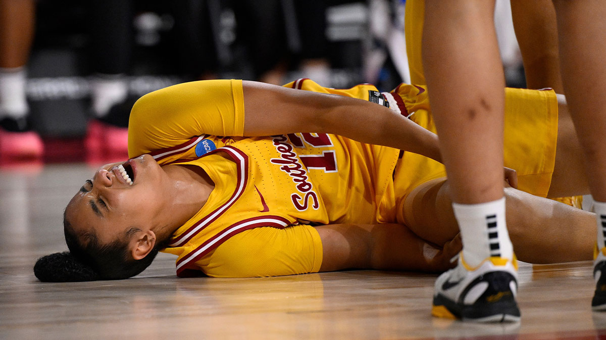 USC Trojans guard JuJu Watkins (12) grimaces after injuring her kneee in the first quarter against the Mississippi State Bulldogs during an NCAA Tournament second round game.
