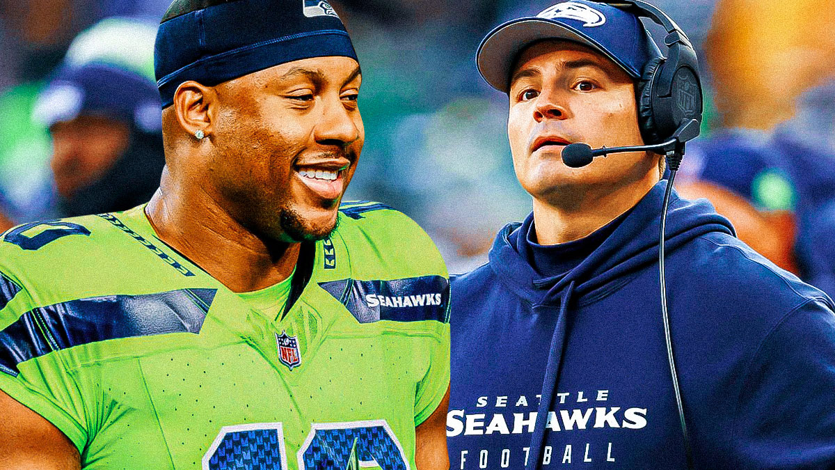 Seattle Seahawks coach Mike Macdonald with Uchenna Nwosu in a Seahawks uniform