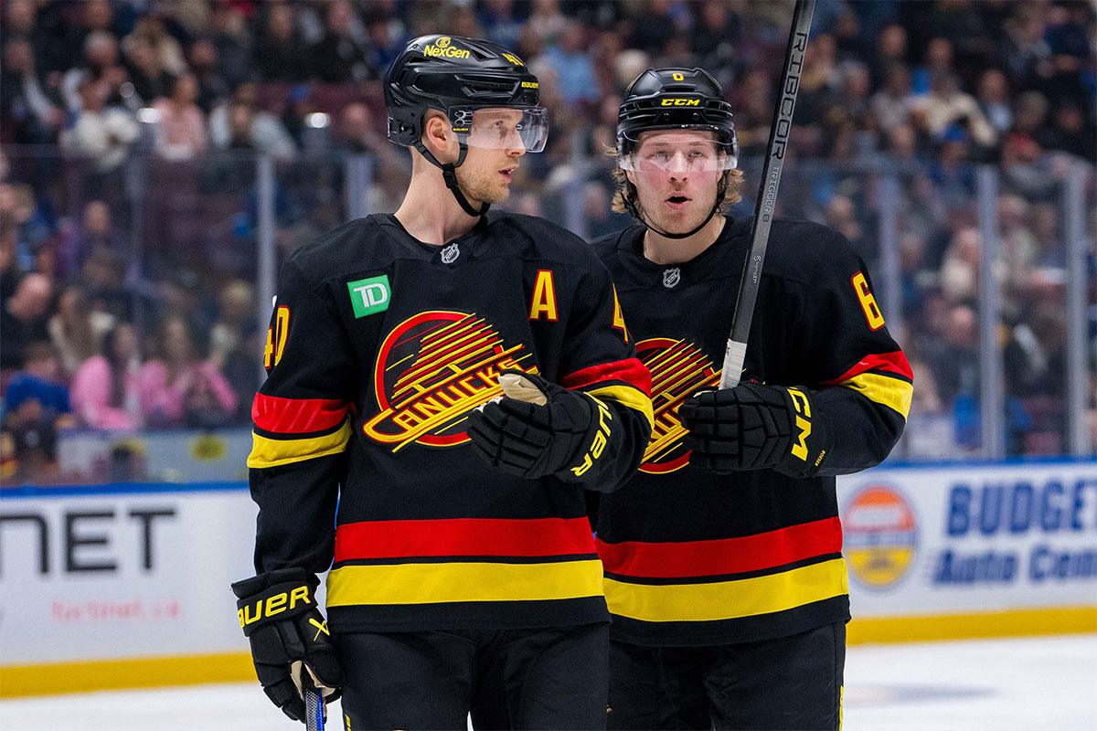 Vancouver Canucks forward Elias Pettersson (40) talks with forward Brock Boeser (6) against the Buffalo Sabres in the second period at Rogers Arena.