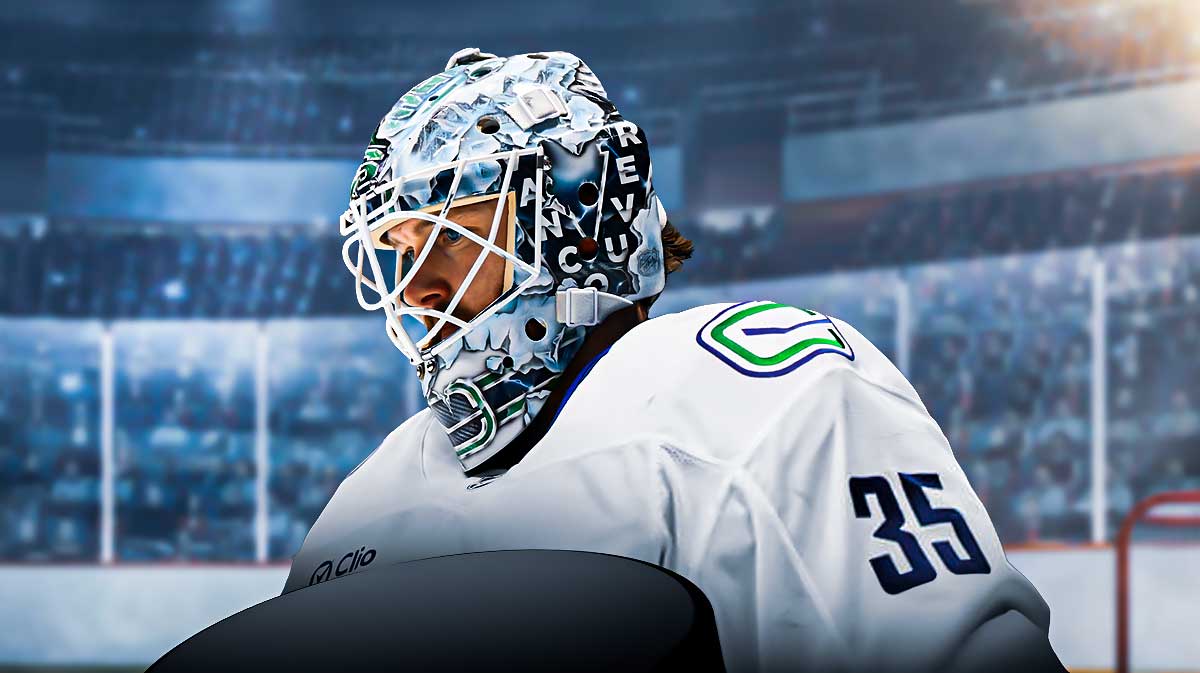 Thatcher Demko Canucks logo in the background.