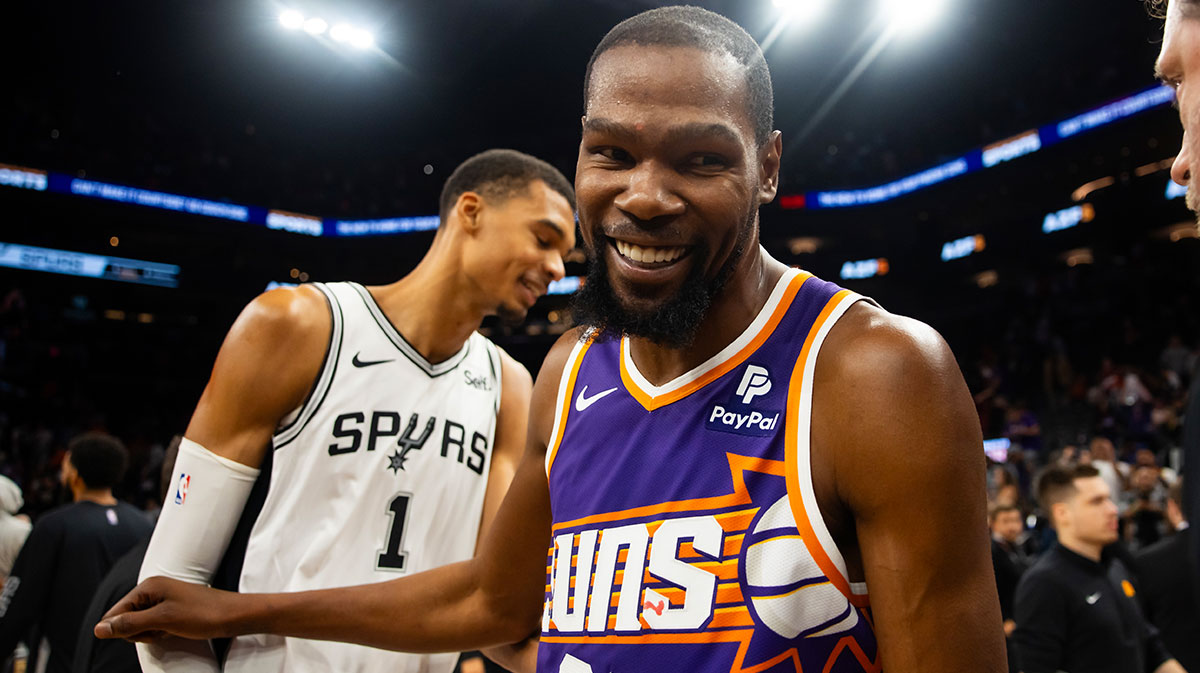 Phoenix Suns forward Kevin Durant (35) greets San Antonio Spurs center Victor Wembanyama (1) following the game at Footprint Center.