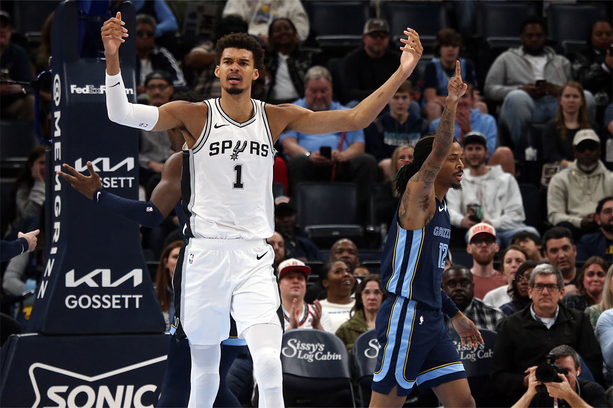 San Antonio Spurs center Victor Wembanyama (1) and Memphis Grizzlies guard Ja Morant (12) react during the first quarter at FedExForum.