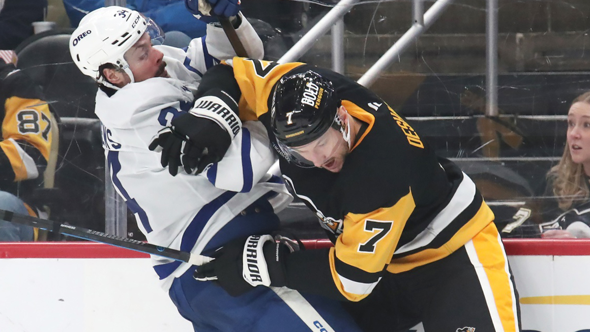 Pittsburgh Penguins defenseman Vincent Desharnais (7) checks Toronto Maple Leafs center Auston Matthews (34) during the second period at PPG Paints Arena.