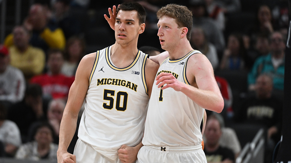 Michigan Wolverines center Vladislav Goldin (50) and center Danny Wolf (1) celebrate after a play during the second half against the Purdue Boilermakers in Big 10 NCAA Tournament at Gainbridge Fieldhouse.
