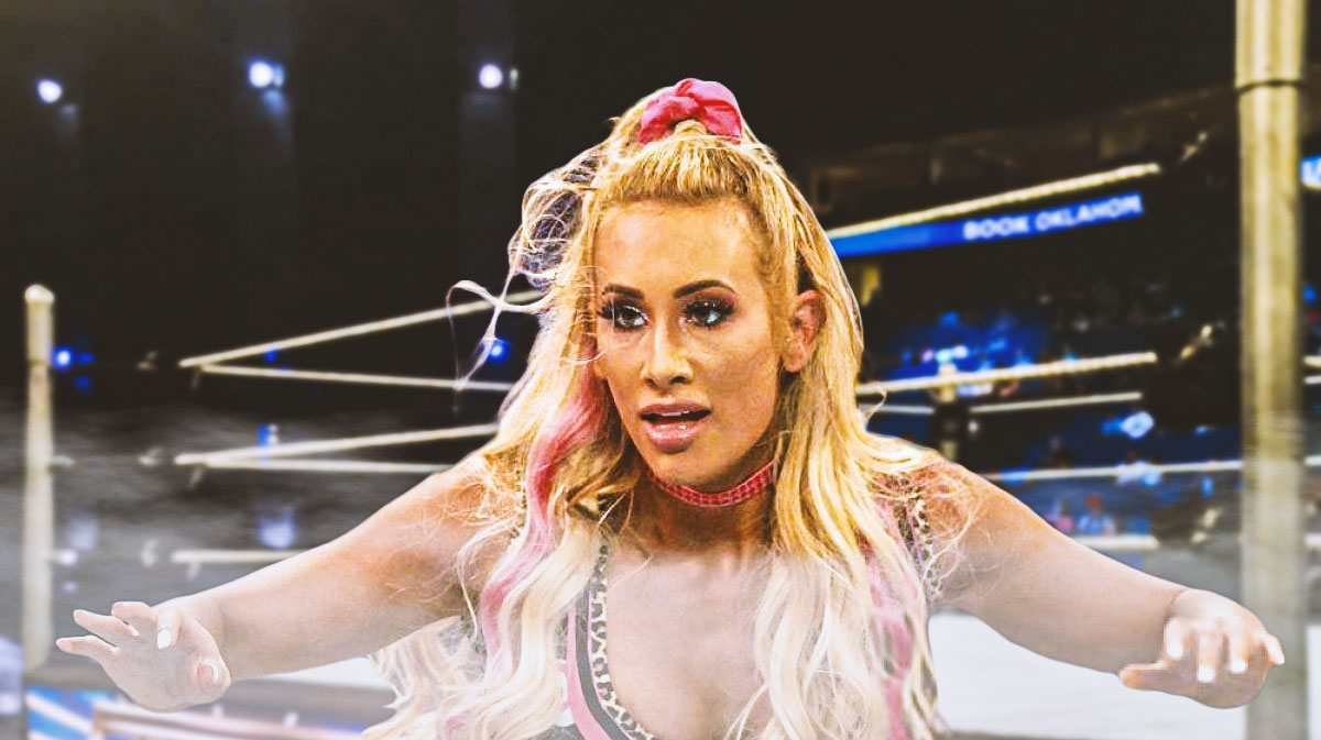 Former WWE Superstar Carmella, who is speaking about her release, with wrestling ring background.
