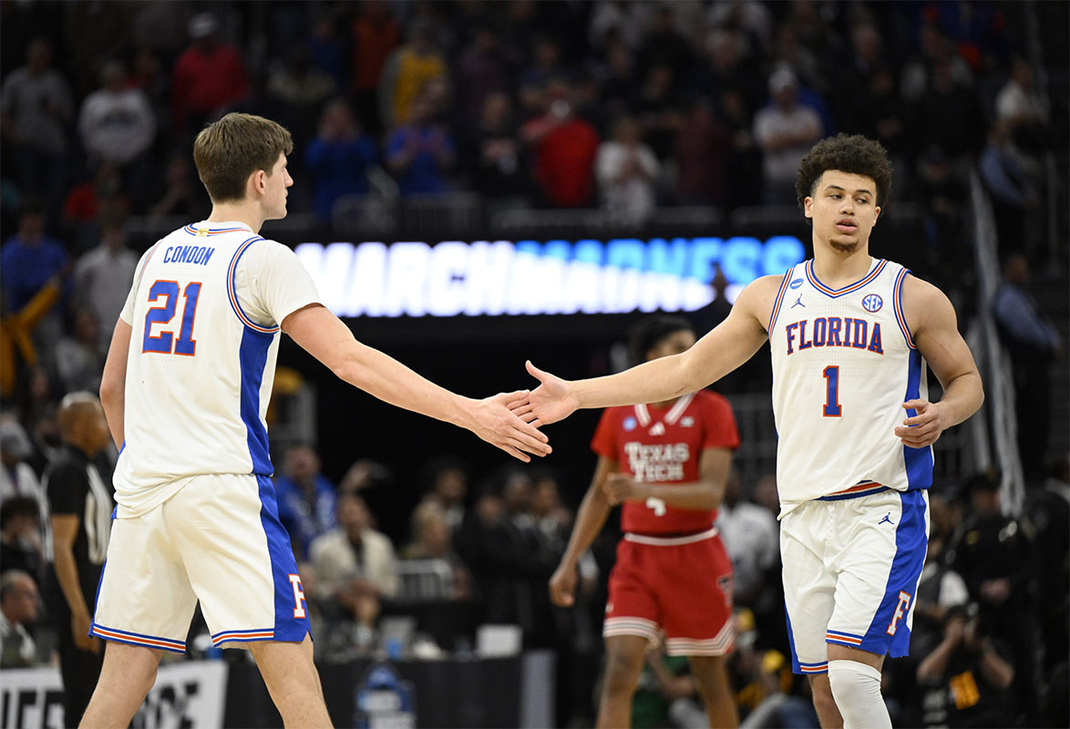Florida Gators forward Alex Condon (21) and Florida Gators guard Walter Clayton Jr. (1) high-five during the second half against the Texas Tech Red Raiders during the West Regional final of the 2025 NCAA tournament at Chase Center.