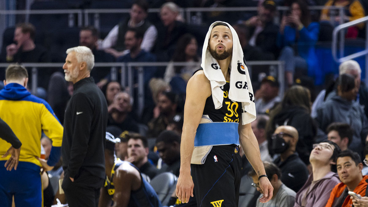 Warriors guard Stephen Curry (30) watches a replay during a review of call during the first quarter against the Toronto Raptors at Chase Center