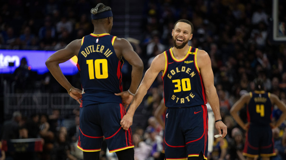 Warriors forward Jimmy Butler III (10) and guard Stephen Curry (30) share a laugh during the second quarter against the Sacramento Kings at Chase Center