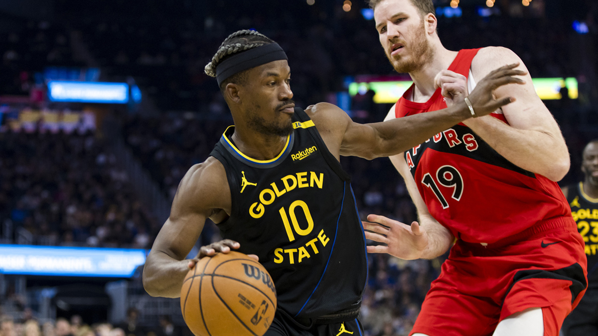 Warriors forward Jimmy Butler III (10) drives past Toronto Raptors center Jakob Poeltl (19) during the second quarter at Chase Center