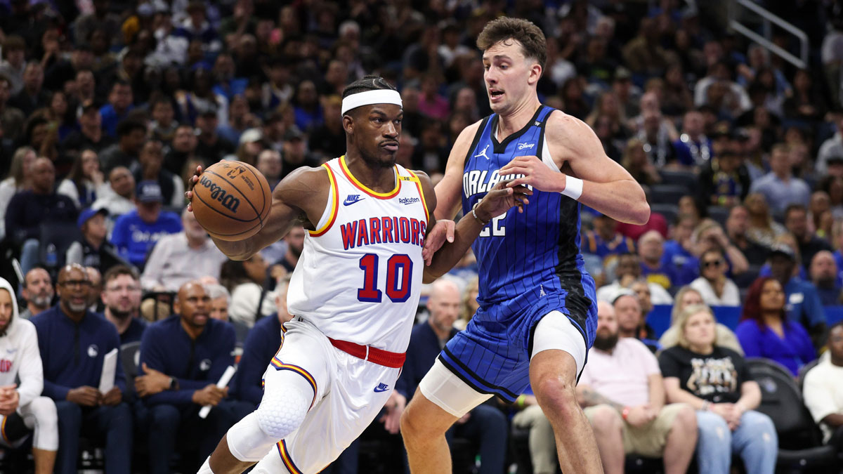 Warriors forward Jimmy Butler III (10) is guarded by Orlando Magic forward Franz Wagner (22) in the fourth quarter at Kia Center