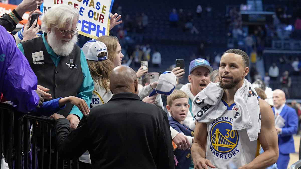 Warriors guard Stephen Curry walks to the locker room