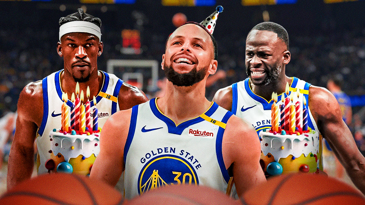 Warriors All-Star Stephen Curry in a birthday hat between Warriors forward Draymond Green and Warriors forward Jimmy Butler with a birthday cake and the Warriors logo in the background