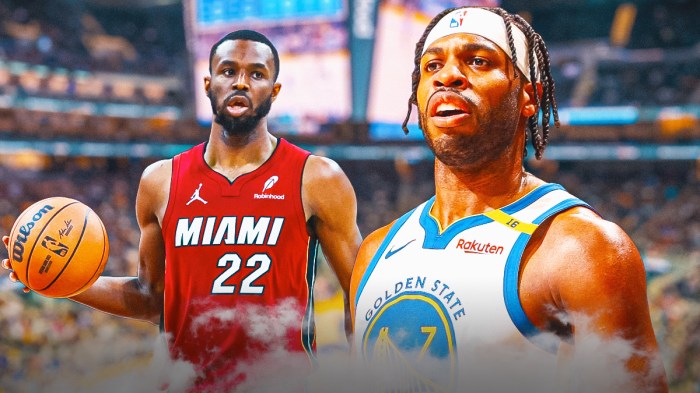 Buddy Hield next to Andew Wiggins on the Warriors court.