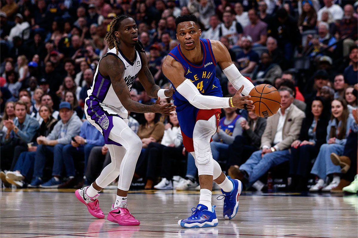 Denver Nuggets guard Russell Westbrook (4) controls the ball as Sacramento Kings guard Keon Ellis (23) guards in the fourth quarter at Ball Arena.