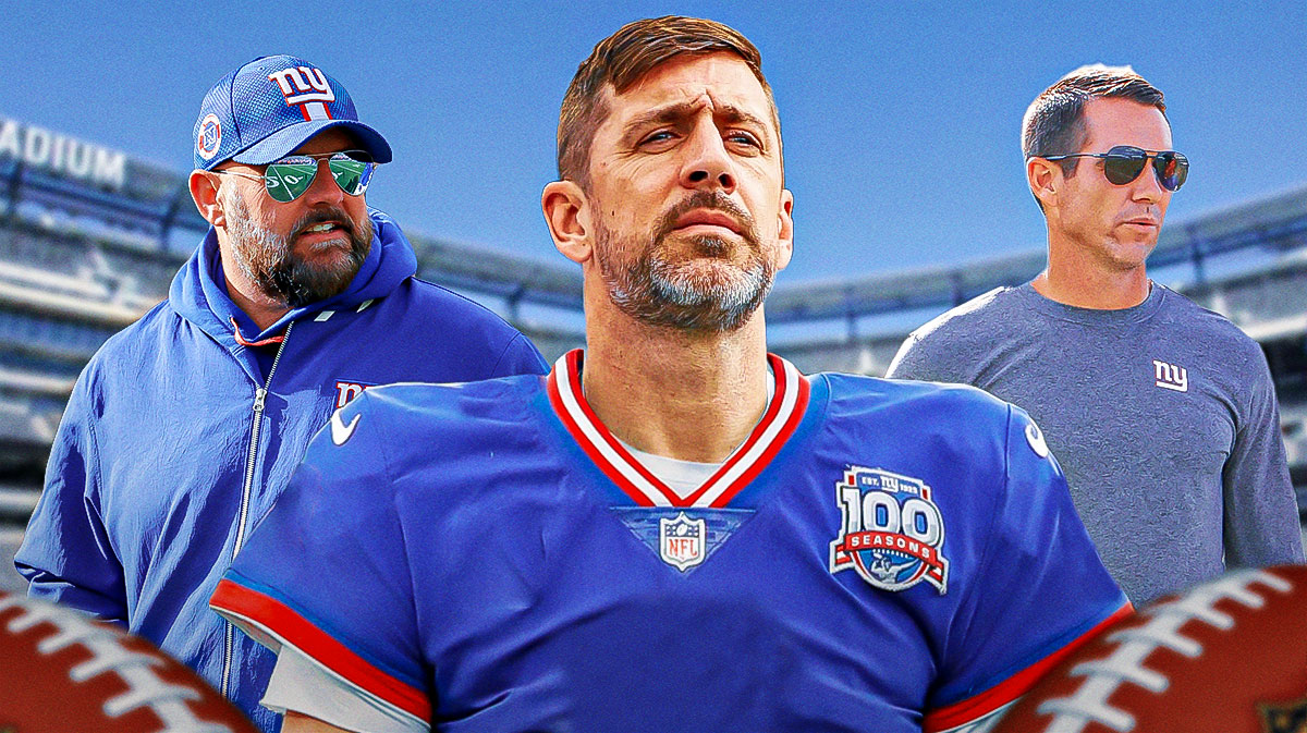 Aaron Rodgers in a New York Giants uniform in between Brian Daboll and Joe Schoen