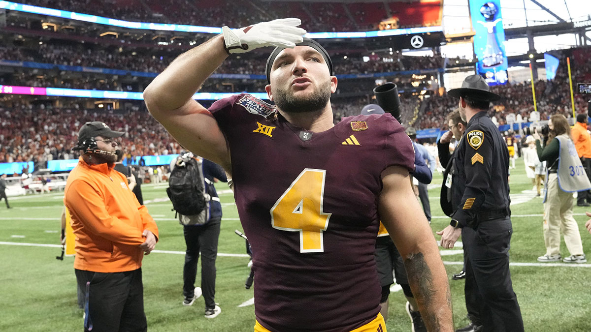 Arizona State running back Cam Skattebo (4) blows a kiss toward fans after Texas won 39-31 in double overtime in the Chick-fil-A Peach Bowl in Atlanta.