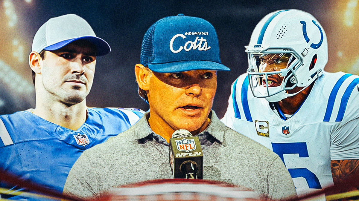 Indianapolis Colts general manager Chris Ballard in the middle with Daniel Jones and Anthony Richardson on either side in front of Lucas Oil Stadium.