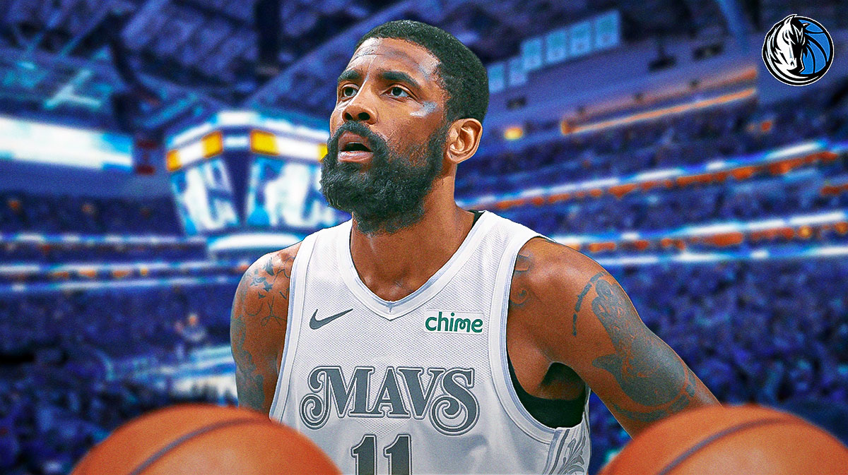 Mavericks Kyrie Irving looking serious, close-up image. Dallas Mavericks logo in background.