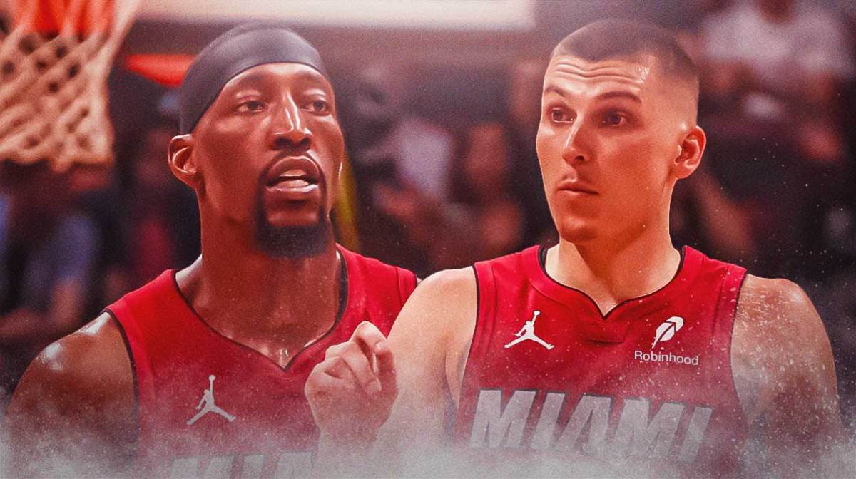 Miami Heat stars Tyler Herro and Bam Adebayo in front of Kaseya Center.