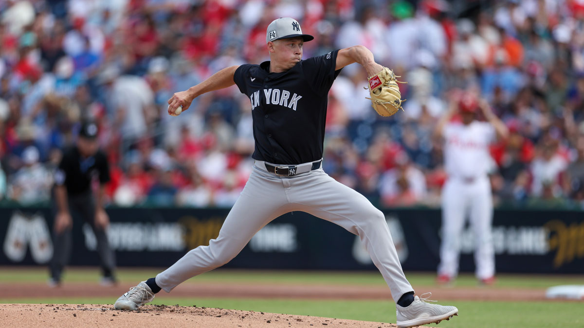 New York Yankees pitcher Will Warren (98) throws a pitch against the Philadelphia Phillies in the first inning during spring training at BayCare Ballpark. 