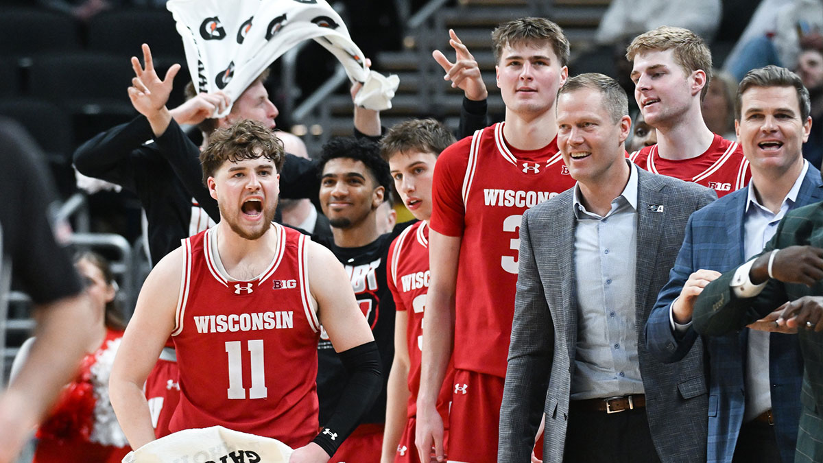 The Wisconsin Badgers bench celebrates during the second half against the UCLA Bruins at Gainbridge Fieldhouse at the Big 10 tournament.