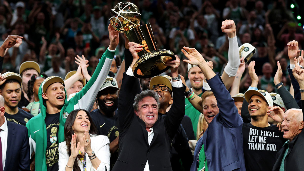 Boston Celtics owner Wyc Grousbeck celebrates with the Larry O’Brien Trophy after the Boston Celtics beat the Dallas Mavericks in game five of the 2024 NBA Finals at TD Garden. 