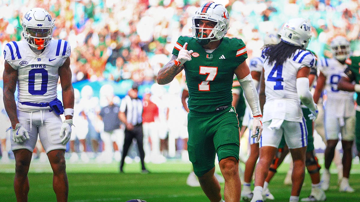 Miami Hurricanes wide receiver Xavier Restrepo (7) celebrates after scoring a touchdown against the Duke Blue Devils during the third quarter at Hard Rock Stadium.