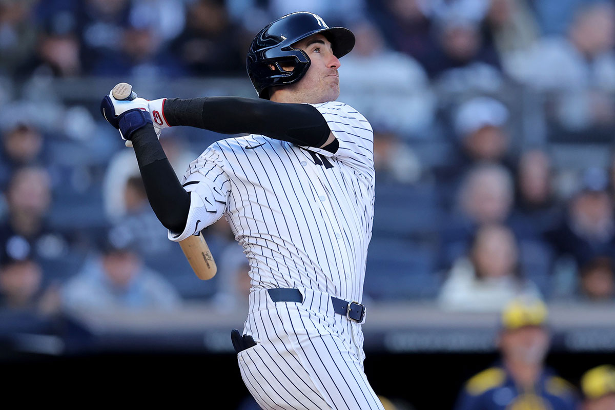 New York Yankees center fielder Cody Bellinger (35) follows through on an RBI sacrifice fly during the seventh inning against the Milwaukee Brewers at Yankee Stadium.