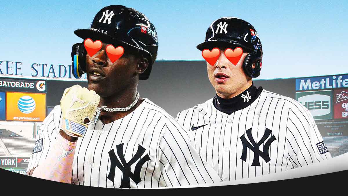 Jazz Chisholm in a New York Yankees uniform with hearts in his eyes looking at Anthony Volpe in a Yankees uniform with hearts in his eyes too as the duo hopes to improve the yankees defense with spring training rapport.