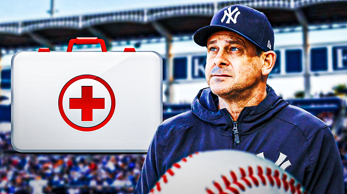Yankees manager Aaron Boone, medical kit, George M. Steinbrenner Field in back