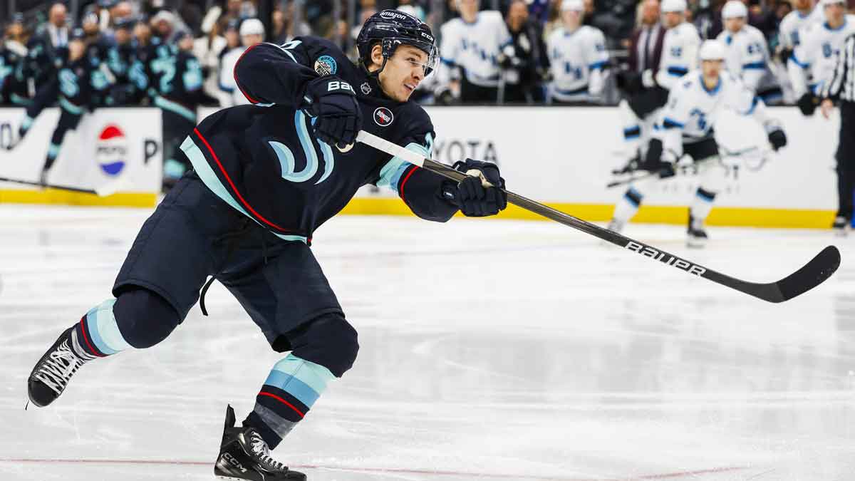 Seattle Kraken center Yanni Gourde (37) shoots the puck against the Utah Hockey Club during the third period at Climate Pledge Arena.