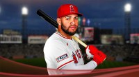 Yoan Moncada in an Angels jersey with the White Sox stadium in the background.