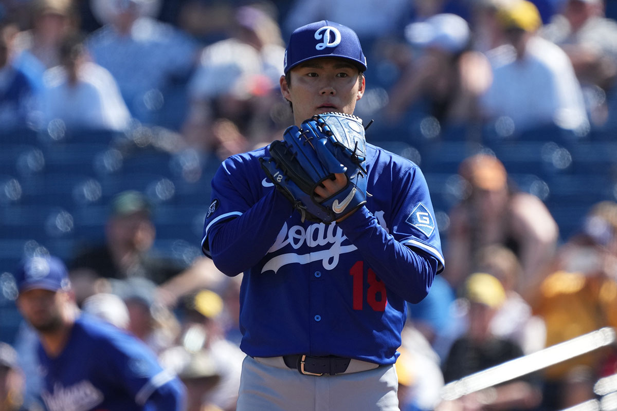 Los Angeles Dodgers pitcher Yoshinobu Yamamoto (18) throws against the Milwaukee Brewers during the first inning at American Family Fields of Phoenix. 