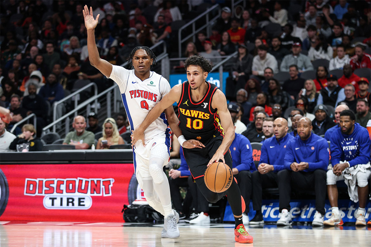 Atlanta Hawks forward Zaccharie Risacher (10) dribbles the ball past Detroit Pistons forward Ausar Thompson (9) during the third quarter at State Farm Arena. 