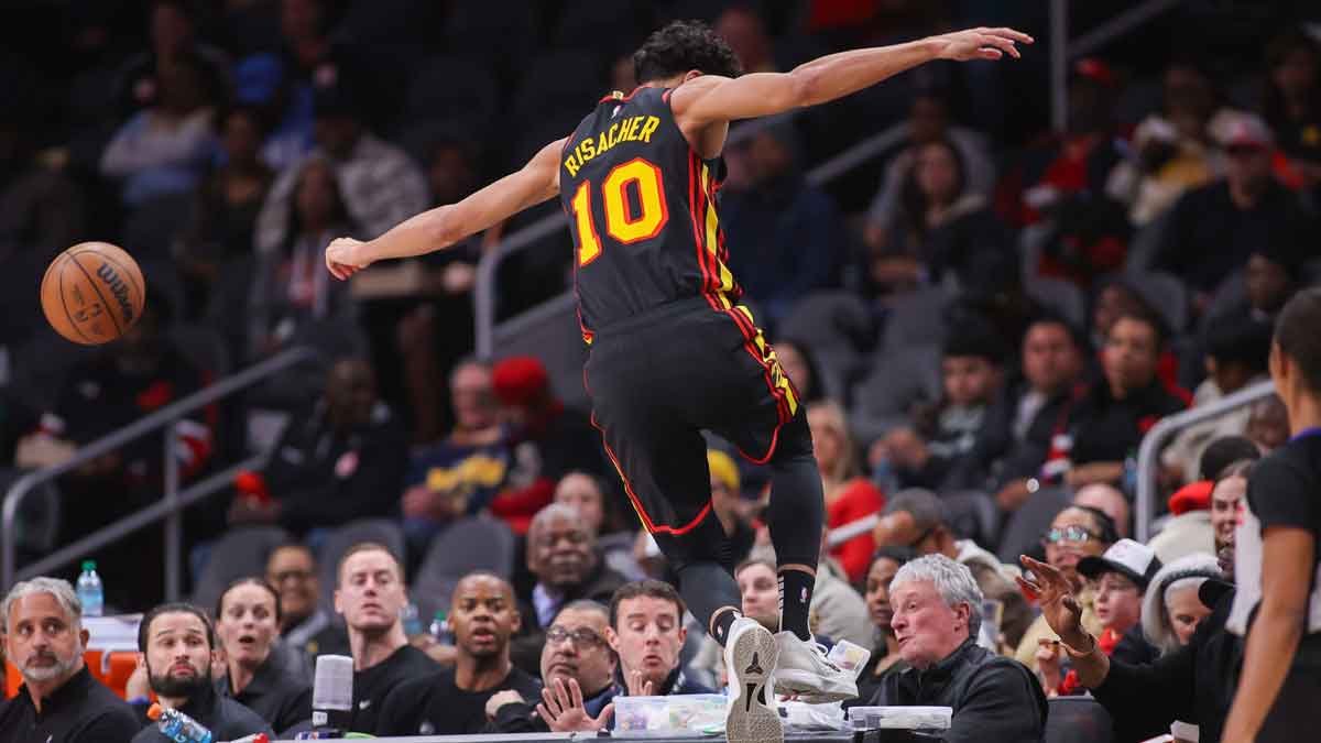 Atlanta Hawks Next Zaharie Risacher (10) Tries to save the ball that exits out of bounds against Indian Peigras in the first quarter at the State Farm Arena. 