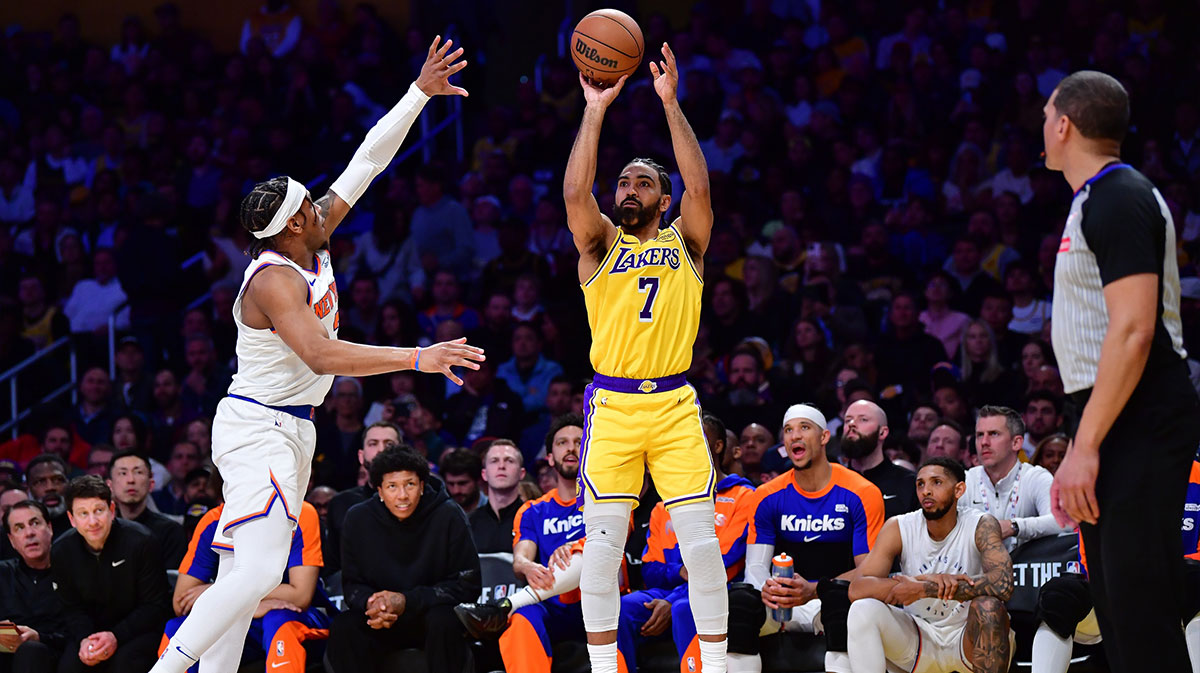 Los Angeles Lakers Guard Gabe Vincent (7) shoots against New York Knicks Guard Miles McBride (2) during the second half at the CRIPTO.com Arena. 