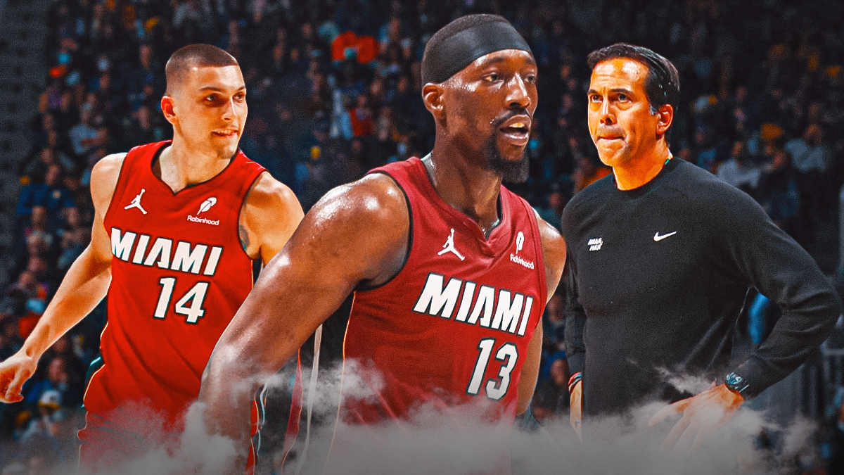 Miami Heat star Bam Adebayo in the middle with Tyler Herro and Erik Spoelstra on either side in front of Kaseya Center.