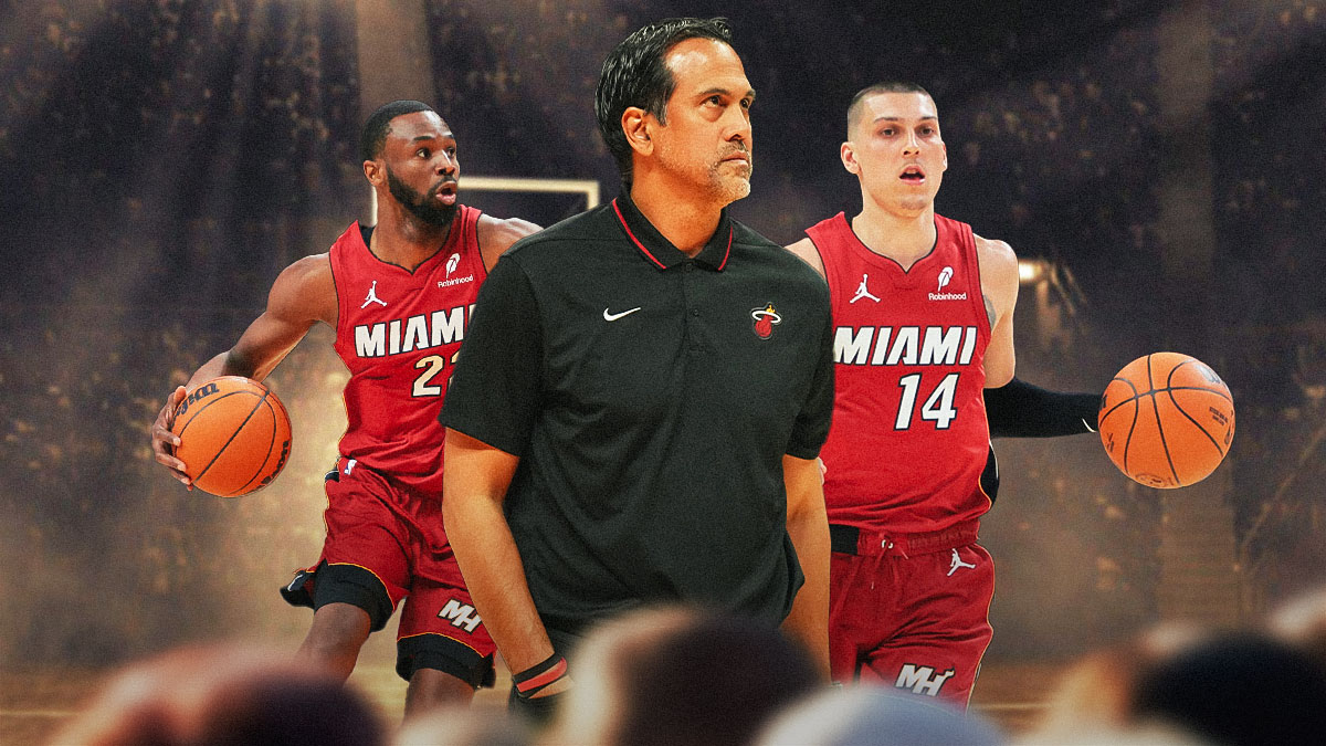 Miami Heat head coach Erik Spoelstra in the middle with Tyler Herro and Andrew Wiggins on either side in front of Kaseya Center.