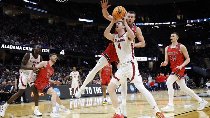 Alabama Crimson Tide forward Grant Nelson (4) looks to the basket defended by St. Mary's Gaels center Mitchell Saxen (11) in the second half during the NCAA Tournament Second Round at Rocket Arena.