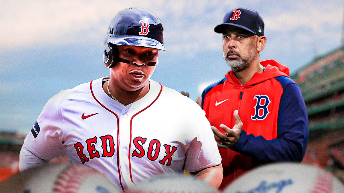 Red Sox 3B Rafael Devers next to manager Alex Cora