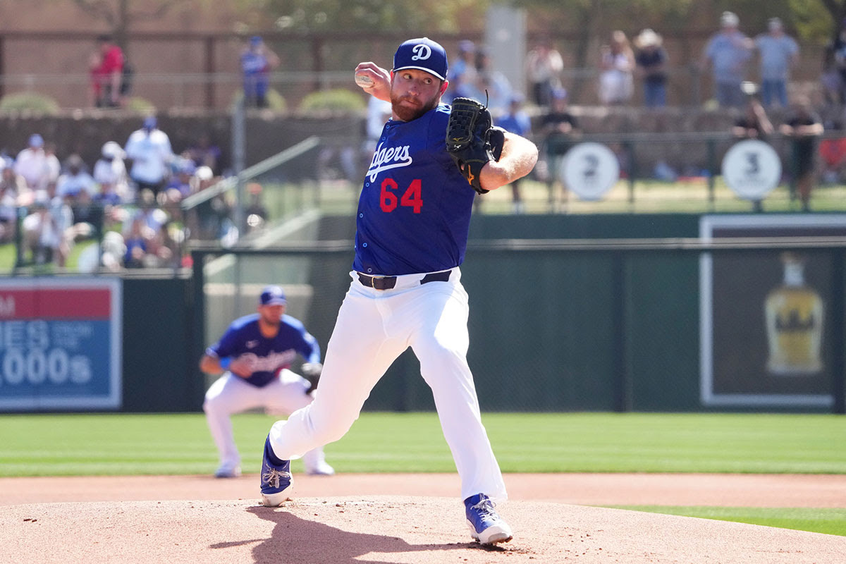 Los Angeles Dodgers pitcher Matt Sauer (64) pitches against the San Francisco Giants during the first inning at Camelback Ranch-Glendale.