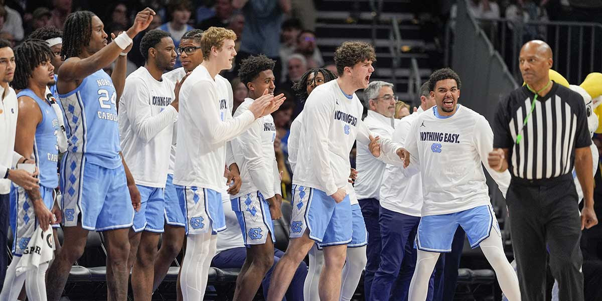 North Carolina Tar Heels bench erupts after a play against the Duke Blue Devils during the second half at Spectrum Center. 