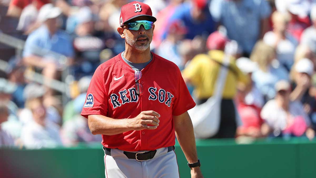 Boston Red Sox manager Alex Cora (13) looks on during the first inning against the Philadelphia Phillies at BayCare Ballpark.
